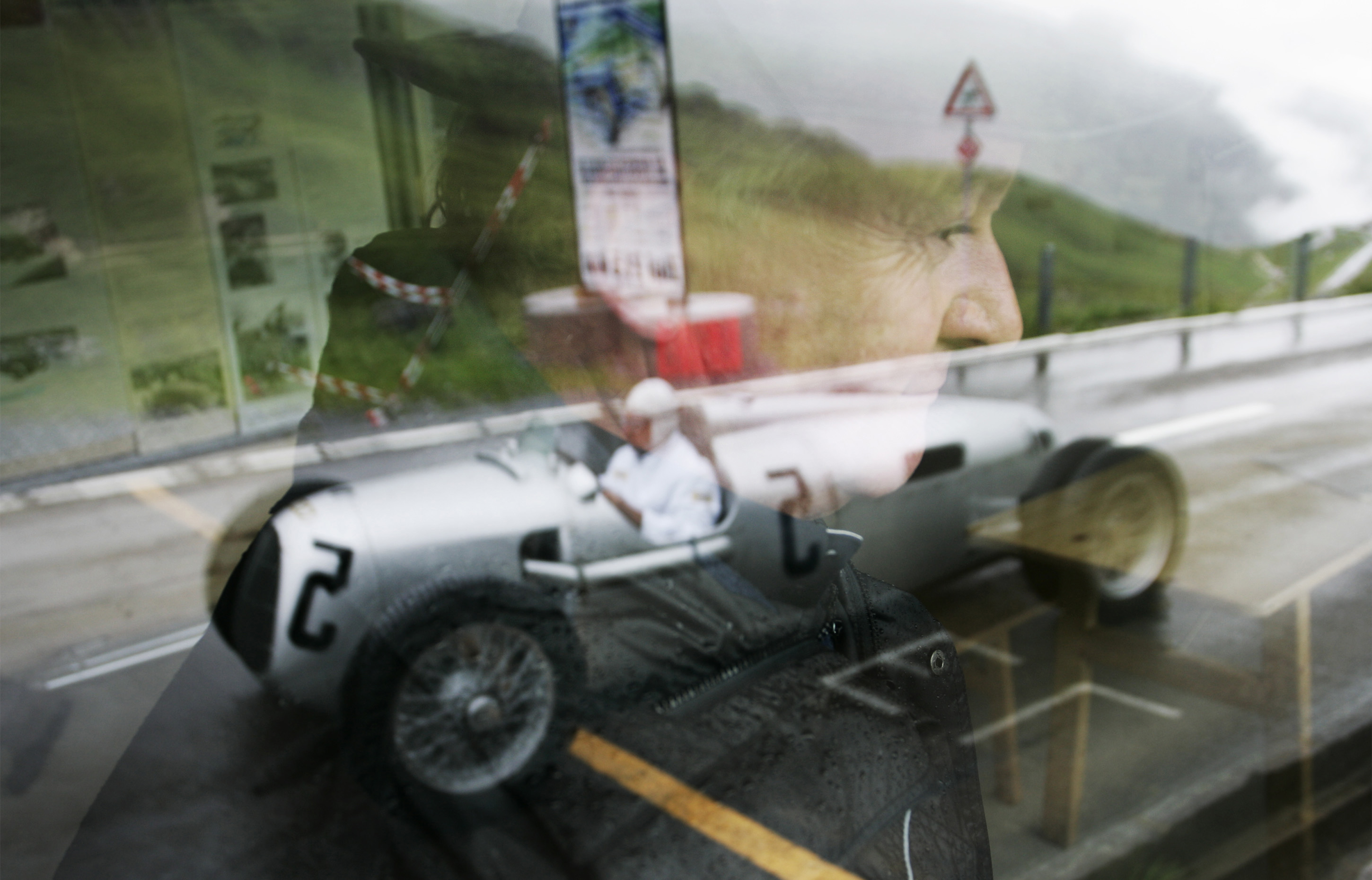 Klausen Pass, Switzerland - Classic 1937 Auto Union C-type races the Klausen Pass, Switzerland. The best racers in the world came together every year from 1922 to 1934 to race the Klausen Pass. Past performances by historic racers included Caracciola, Stuck, Nuvolari, and Chiron.